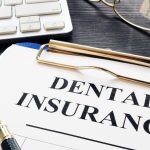 Dental insurance form and pen on a desk. Semple Solutions LLC